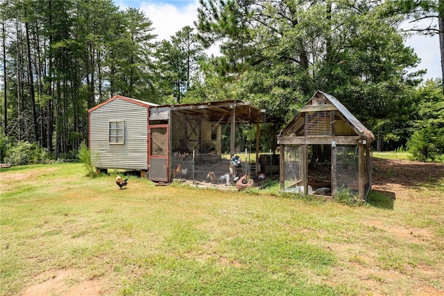 view of outbuilding with a lawn