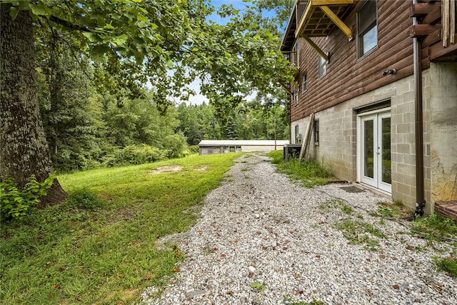 view of yard with french doors