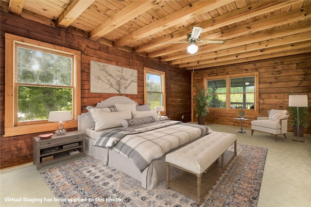 bedroom with wood walls, beamed ceiling, wooden ceiling, carpet flooring, and ceiling fan