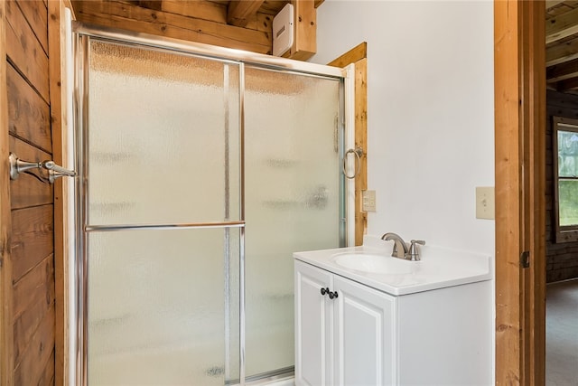 bathroom with vanity and an enclosed shower