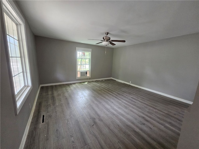 unfurnished room with ceiling fan and dark hardwood / wood-style floors