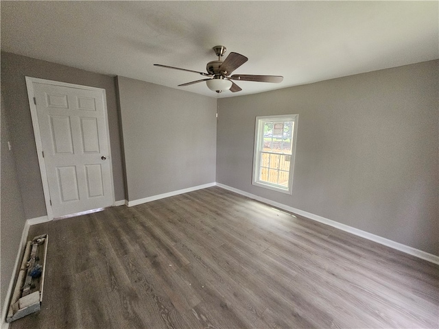 unfurnished room featuring ceiling fan and hardwood / wood-style floors