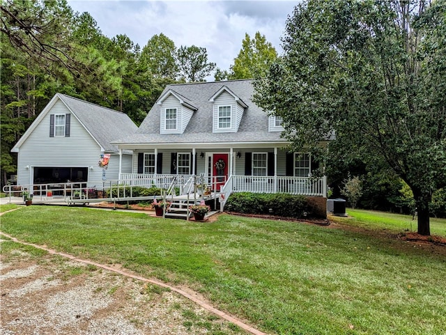 new england style home featuring a porch, a front lawn, and central AC