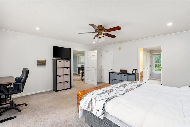 bedroom featuring recessed lighting, light colored carpet, crown molding, and baseboards