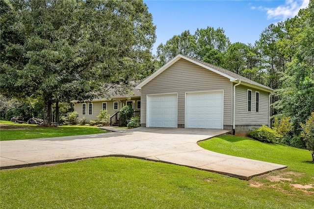 ranch-style home featuring an attached garage, a front lawn, and concrete driveway