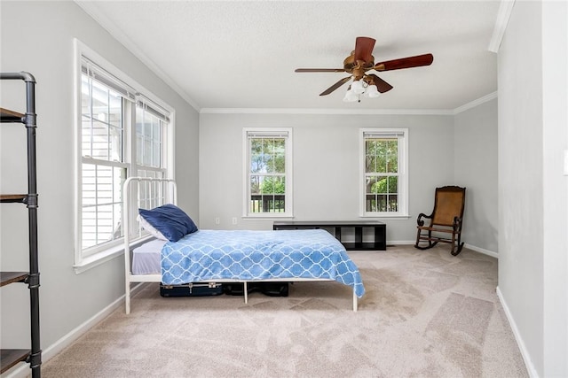 bedroom with ornamental molding, light carpet, and baseboards