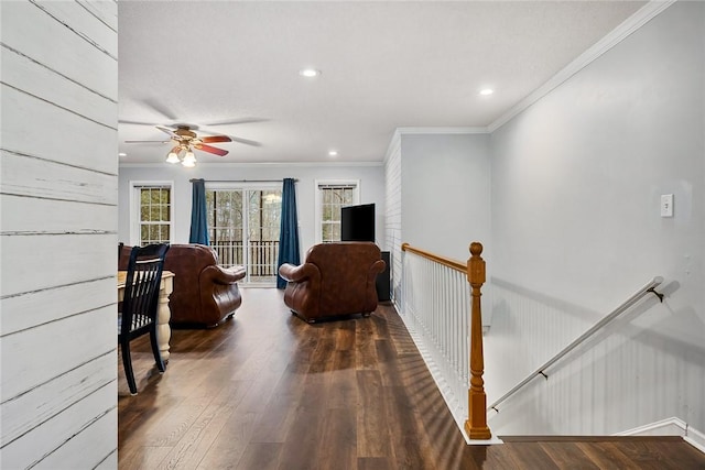 interior space featuring baseboards, dark wood finished floors, a ceiling fan, crown molding, and recessed lighting