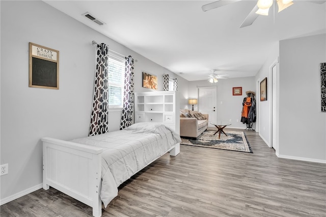 bedroom with wood-type flooring and ceiling fan