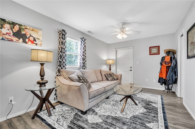 living room featuring hardwood / wood-style floors and ceiling fan