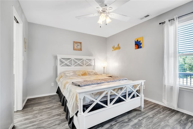 bedroom featuring ceiling fan and hardwood / wood-style flooring