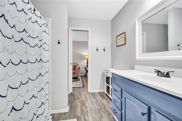 bathroom featuring hardwood / wood-style floors and vanity