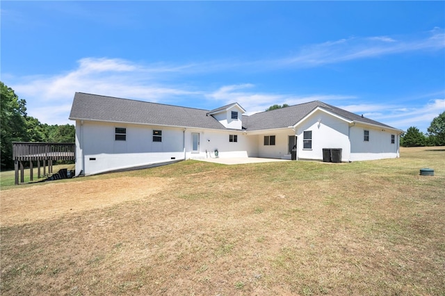 rear view of house with a yard and a patio