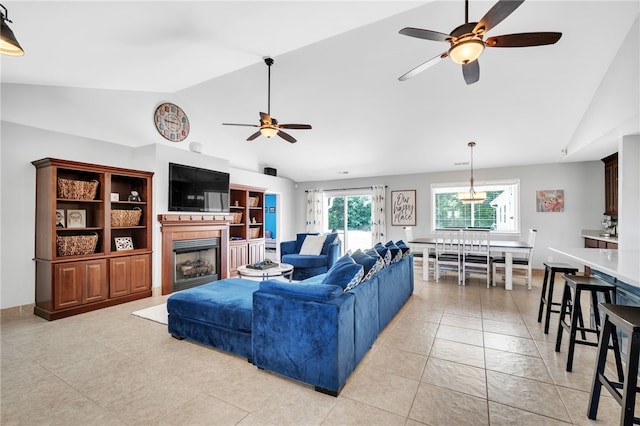 tiled living room featuring high vaulted ceiling and ceiling fan