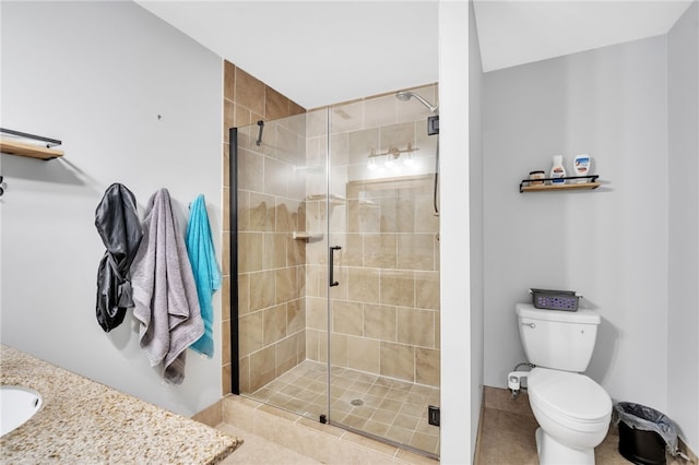 bathroom featuring walk in shower, vanity, and toilet