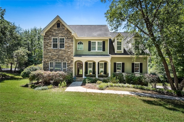 view of front facade featuring a porch and a front lawn