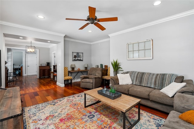 living room featuring crown molding, ceiling fan with notable chandelier, and dark hardwood / wood-style flooring