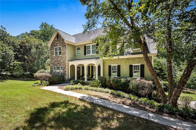 view of front of home featuring a front lawn and a porch