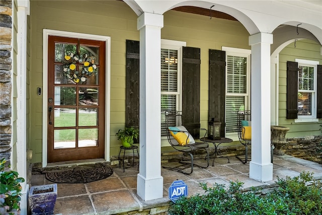 entrance to property with a porch