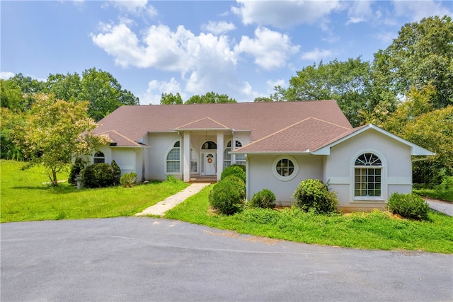 view of front of home with a front lawn