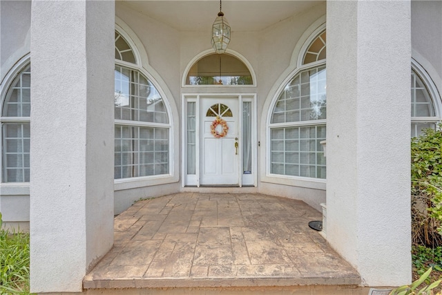 property entrance with a patio