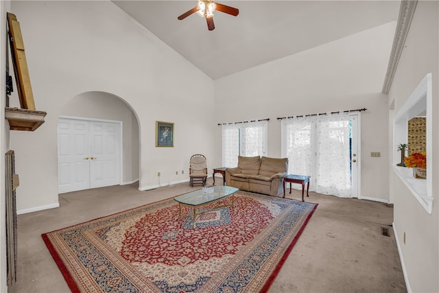 living room with high vaulted ceiling, ceiling fan, and carpet floors