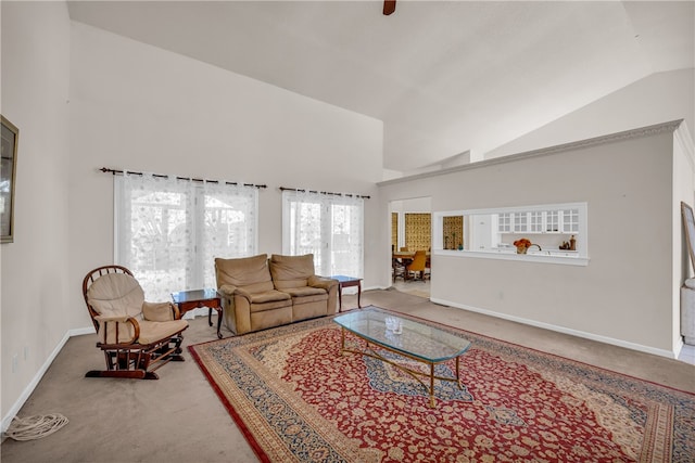 living room featuring carpet and high vaulted ceiling