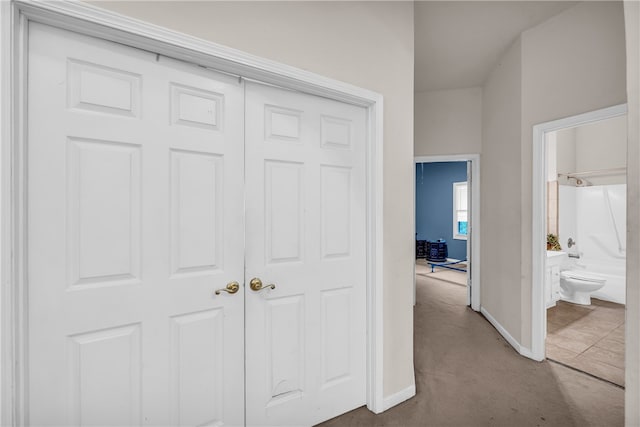 hallway featuring concrete floors