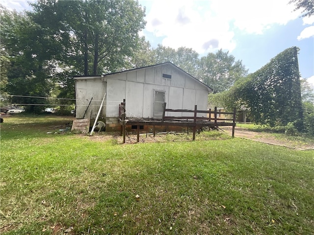 rear view of property with a lawn