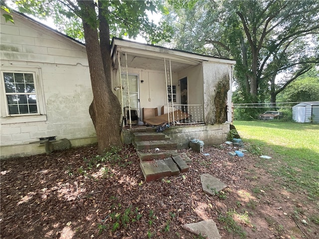 exterior space featuring a yard and covered porch