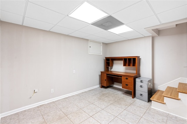 unfurnished office with a paneled ceiling