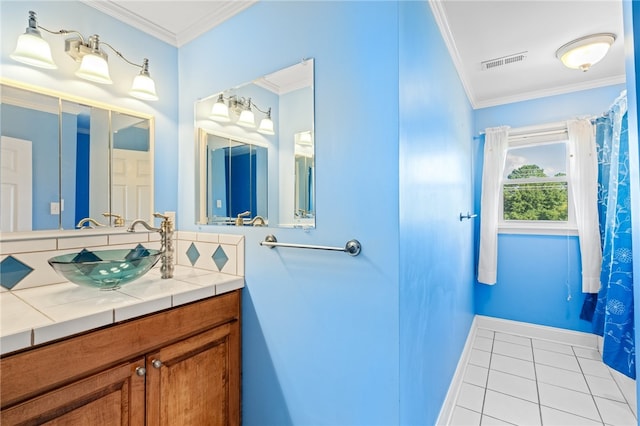 bathroom featuring vanity, tile patterned flooring, and ornamental molding