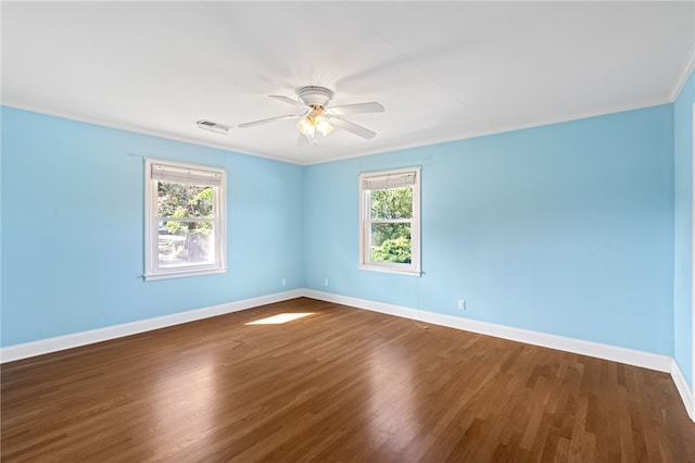 empty room with ceiling fan, ornamental molding, and hardwood / wood-style floors