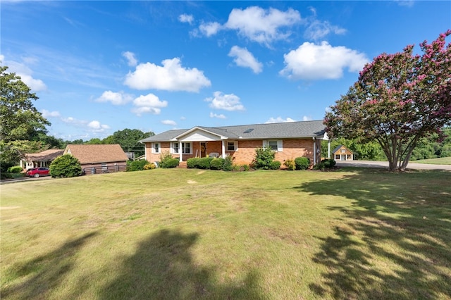 ranch-style home with a front lawn