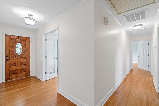 entryway featuring light hardwood / wood-style flooring and ornamental molding