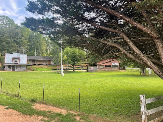 view of yard with a rural view