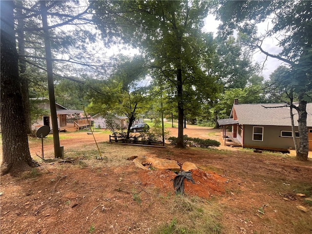 view of yard featuring a wooden deck