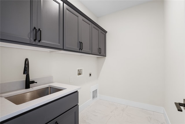 laundry area with cabinets, sink, washer hookup, and electric dryer hookup