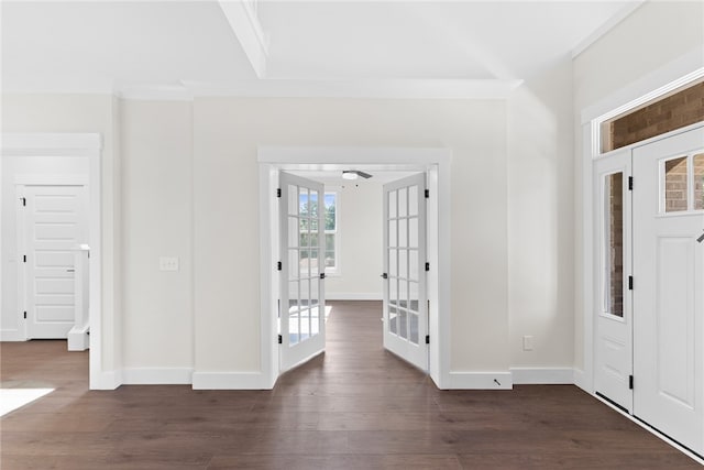 entryway featuring ornamental molding, french doors, and dark hardwood / wood-style floors