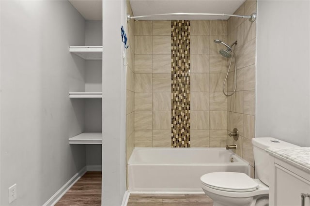 full bathroom featuring shower / bath combination, vanity, toilet, and wood finished floors