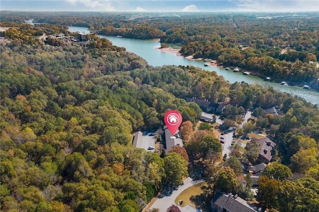 bird's eye view with a forest view and a water view