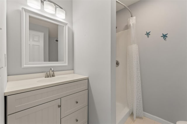 bathroom with vanity and curtained shower