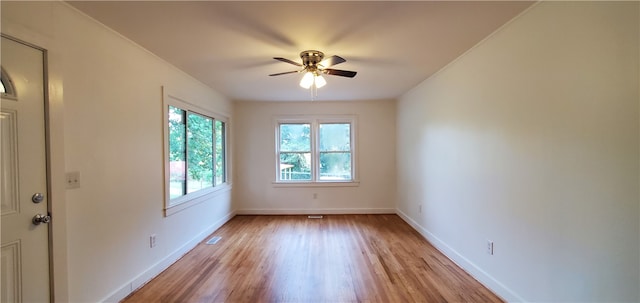 empty room with light hardwood / wood-style floors and ceiling fan