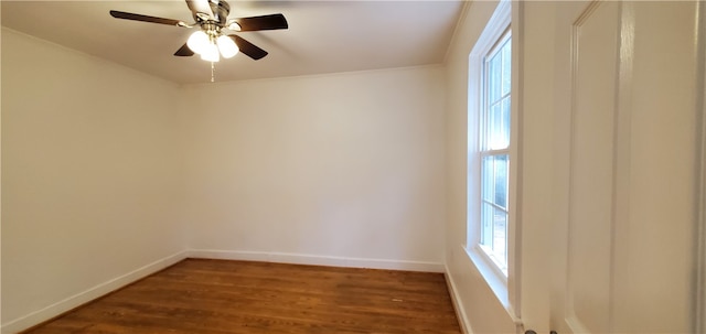 spare room with ceiling fan and dark wood-type flooring