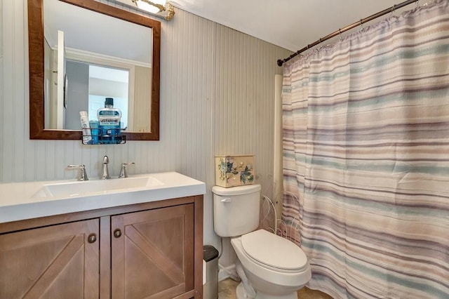 bathroom featuring vanity, toilet, and walk in shower