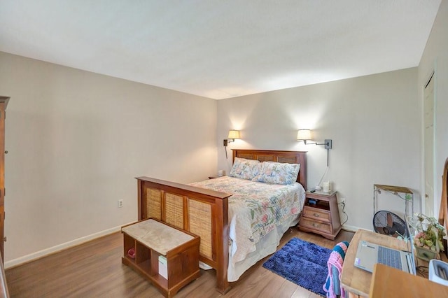 bedroom with wood-type flooring