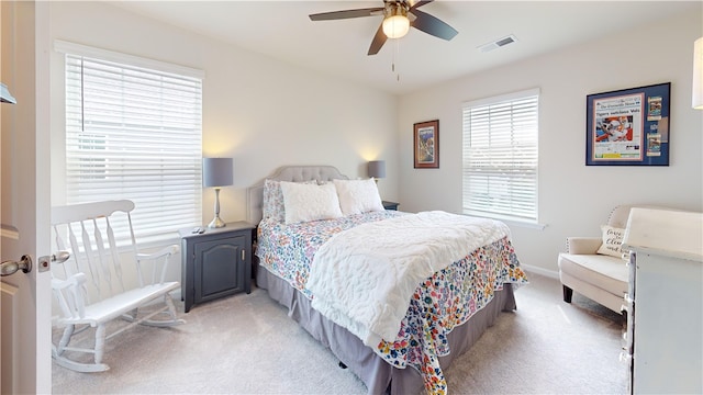 bedroom featuring ceiling fan and light colored carpet