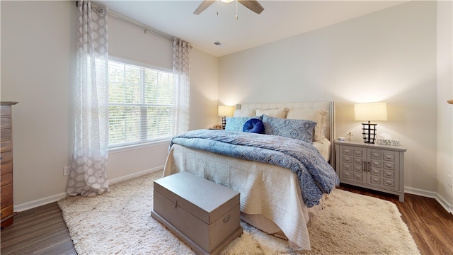 bedroom with hardwood / wood-style floors and ceiling fan