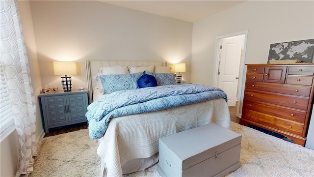 bedroom with hardwood / wood-style floors