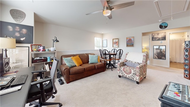 carpeted living room featuring ceiling fan