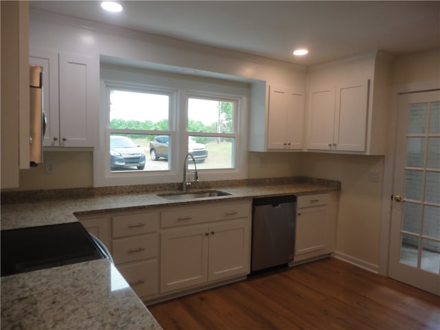 kitchen with white cabinets, dishwasher, sink, and dark hardwood / wood-style flooring